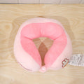 Lightweight pink and white U shape pillow for restful travel